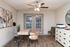 Inviting home office space with modern decor, featuring stylish furniture, vibrant artwork, and large windows for natural light.