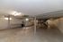 Spacious basement with ample lighting, featuring laundry facilities and storage areas, ideal for multi-purpose use.