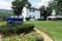 Charming apartment at Views at Signal Mountain surrounded by lush green lawns and vibrant landscaping.