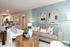 Modern living room with stylish decor, cozy sofas, wooden accents, and an inviting open-plan kitchen.