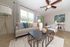 Contemporary living room with stylish decor, featuring a cozy beige sofa, elegant lighting, and artistic wall art, perfect for relaxation.