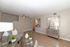 Inviting living room featuring elegant decor, hardwood floors, and modern ceiling fan.