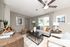 Bright and stylish living room featuring a cozy beige sofa, elegant decor, and large window with natural light.