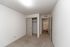 Inviting bedroom with plush carpet, ample closet space, and connection to a modern bathroom.