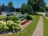 Inviting apartment entrance with lush landscaping and modern architecture at Rivetra, Lexington.