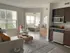 furnished kitchen and living room overlooking bedroom