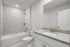Bathroom with mirror and tub