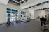Modern fitness center with state-of-the-art treadmills and exercise bikes overlooking a sunny pool area.