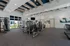Modern fitness center with state-of-the-art gym equipment, natural lighting, and contemporary design.