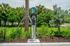 Eco-friendly EV charging station set amidst lush greenery, perfect for sustainable living enthusiasts.