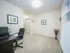 Bright home office with modern desk, ergonomic chair, stylish decor, and ample natural light from a large window.