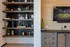 Modern living room showcasing elegant shelving with decorative accents, a sleek entertainment unit, and a mounted television, perfect for stylish urban living.