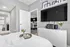 Modern bedroom with elegant decor, featuring a wall-mounted TV, stylish bookshelf, and a comfortable white bed with a cozy throw blanket and floral accents.