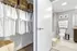Modern apartment bathroom with elegant decor, showcasing a well-organized walk-in closet filled with neatly hung white shirts and woven storage baskets.
