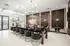 Luxurious dining area with chic black chairs, elegant chandeliers, and decorative privacy screens, perfect for fine dining experiences.
