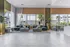 Elegant and spacious living area with modern furniture, large windows, and stylish decor, inviting natural light for a warm, welcoming atmosphere.