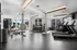 Modern fitness center with state-of-the-art treadmills, diverse weight options, and a bright, inviting atmosphere.