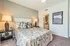 Elegant bedroom with stylish bedding, soft lighting, and sleek decor showcasing modern comfort.