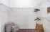 Spacious walk-in closet with sleek wire shelving, ready for customization with stylish storage baskets and hangers.