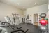 Modern fitness center featuring state-of-the-art exercise equipment, free weights, and vibrant exercise balls, perfect for a dynamic workout experience.