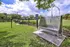 Inviting outdoor dog wash in a lush green park setting, perfect for pet-friendly living.
