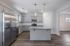 unfurnished kitchen area with island in home