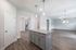unfurnished kitchen island and living area in home