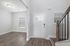 unfurnished foyer area with stairs and room in home