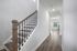unfurnished foyer hallway with stairs and room in home