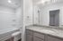 unfurnished bathroom with bathtub, toilet and sink