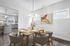 Virtually staged dining room with table and chairs