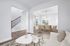 Virtually staged Living room with couch and coffee table and dining room with table and chairs