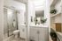En suite bathroom with additional sink and vanity