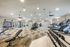Modern fitness center with an extensive collection of free weights and exercise equipment for a full-body workout.