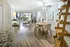 Charming apartment interior showcasing a bright, open-concept living and dining area with stylish decor and abundant natural light.