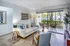 bright living room with spacious patio and hardwood floors