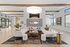 Bright and stylish resident lounge featuring modern furniture, a decorative fireplace wall, and natural wood accents.