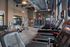 Modern fitness center with treadmills, ellipticals, stationary bikes, and strength machines.