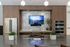 Modern entertainment kitchen with sleek countertops, stainless steel appliances, ample seating, and open space designed for gatherings and social events.