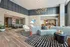 Resident lounge with modern seating, stylish decor, and ambient lighting.