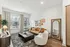 Modern living room featuring a cozy brown leather sofa, elegant decor, and stylish lighting.