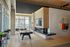 Elegant apartment lounge with a pool table, modern fireplace, and stylish decor.
