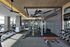 State-of-the-art gym with modern fitness equipment and expansive city views.
