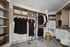 Elegant walk-in closet with ample shelving, hanging space, and neutral decor.