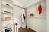 Spacious and organized walk-in closet with clothing racks and shelving units.
