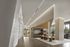 Modern lobby featuring elegant dining area, sleek architecture, and ambient lighting.