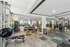 Modern, well-equipped gym with advanced fitness machines, free weights, and a spacious workout area.