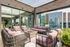 Luxurious rooftop terrace with comfortable seating, modern fire pit, and stunning cityscape views.