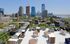 Breathtaking rooftop terrace offering panoramic skyline views with modern seating areas and outdoor grills.