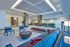 Modern and inviting lobby area with chic seating, stylish decor, and lush greenery creating a welcoming atmosphere.